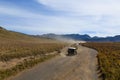 Jeeps pass through Bromo mountain savana