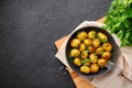 Jeera Aloo in black bowl on dark slate background. Jeera Aloo is indian cuisine dish