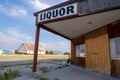 The abandoned and closed liquor store in the ghost town, boarded up