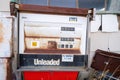 Abandoned gas station pumps next to a closed service station