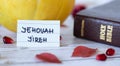 Jehovah Jireh, a handwritten name of God with Holy Bible book. Royalty Free Stock Photo