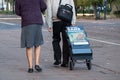 Jehovah witnesses walking in the street with french text on trolley