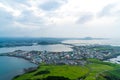 Jeju city skyline view from Seongsan Ilchulbong, Jeju Island. Royalty Free Stock Photo