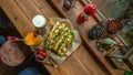 Jeju City,South Korea-July 2019: Top view image of two baguette sandwiches and two glasses of juices on a wooden table with Royalty Free Stock Photo