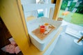 Jeju City,South Korea-July 2019: Two glasses of strawberry and orange ade drinks on a wooden tray inside a cafetaria