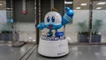 A robot figurine on a pedestal with the inscription `Welcome to Jeju` in blue and white at