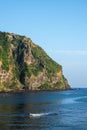 JEJU ISLAND, KOREA: View of Seongsan Ilchulbong Volcanic Cone from the town at the foothill. Royalty Free Stock Photo