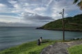 Man is taking picture of sitting woman on Jeju