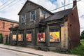 Old wooden building with colourful paintings instead of windows Royalty Free Stock Photo