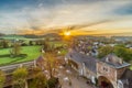 Jeker valley during a spectacular autumn sunrise with amazing sun beams overlooking Chateau Neercanne