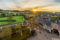 Jeker valley during a spectacular autumn sunrise with amazing sun beams overlooking Chateau Neercanne