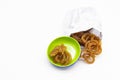 Jelebi or Jilbi in paper packet isolate on white background Royalty Free Stock Photo