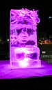 Jelgava / Latvia - February 10th, 2017: Small carved ice sculpture of an old man with a pipe at night of International Ice Sculpt