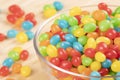 Jelly Beans candy in glass bowl isolated on wooden background Royalty Free Stock Photo