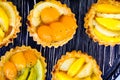 Jelly fruit baskets on a black striped table Royalty Free Stock Photo