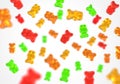 Jelly gummy bears flying candy background. Fruit gum candies theme. Red, orange, yellow and green. Royalty Free Stock Photo