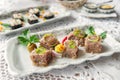 Jelly with meat, aspic beef, traditional Russian dish, portion on a plate, mustard and horseradish. Restaurant serving. Selective Royalty Free Stock Photo