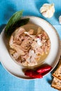 Jelly with meat, beef aspic, traditional dish. portion on plate. Bread and chili Royalty Free Stock Photo