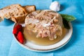 Jelly with meat, beef aspic, traditional dish. portion on plate. Bread and chili Royalty Free Stock Photo
