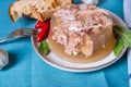 Jelly with meat, beef aspic, traditional dish. portion on plate. Bread and chili Royalty Free Stock Photo