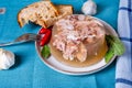 Jelly with meat, beef aspic, traditional dish. portion on plate. Bread and chili Royalty Free Stock Photo