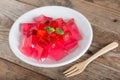 Jelly strawberry with fresh strawberry slices.