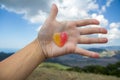 Jelly sweet candy heart on outstretched palm