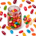 Jellybeans in a jar, white jellybean background. Royalty Free Stock Photo