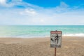 Jellyfish warning sign at beach .