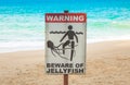 Jellyfish warning sign at beach .