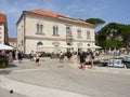 Jelsa, Croatia - July 25, 2021. Marina and old town with tourists on the island of Hvar Royalty Free Stock Photo