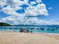 Jember, Indonesia - January 2023 : the fishermen work together to lower the boat to sail on the beach of papuma jember