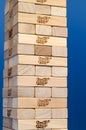 Jenga tower constructed with blue background