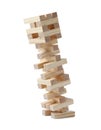 Jenga tower made of wooden blocks falling on white background