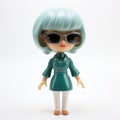 Jennifer: A Shiny Vinyl Toy With Green Hair And Sunglasses Royalty Free Stock Photo