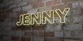 JENNY - Glowing Neon Sign on stonework wall - 3D rendered royalty free stock illustration