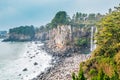 Jeongbang Waterfall and sea in Jeju Island, Korea Royalty Free Stock Photo