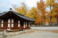 Jeonju Hanok Village, South Korea - 09.11.2018: a couple in hanbok dress inside of traditional palace.