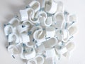Round cable clips. Isolated background in white. Copy space. Top view. Flat lay photography.