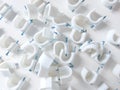 Round cable clips. Isolated background in white. Copy space. Top view. Flat lay photography.