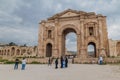 JERASH, JORDAN - APRIL 1, 2017: Tourists in front of the Arch of Hadrian in Jerash, Jord
