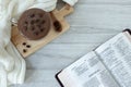 Jeremiah open holy bible book with coffee cup on table, top view