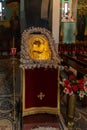 Gilded icon depicting the Mother of God with a baby in her hands in the Monastery Deir Hijleh - Monastery of Gerasim of Jordan, in