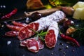 Jerked Italian salami with rosemary, spices, olives and oil. Dar