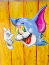 Jerry's portrait (from Tom & Jerry cartoons) on a wooden background