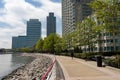 Jersey City New Jersey Riverfront along the Hudson River with Green Trees and Skyscrapers Royalty Free Stock Photo