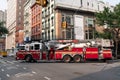 Jersey City, USA - June 30, 2023: firetruck truck Fire Department turning a corner side view
