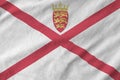 Jersey flag depicted on folded wavy fabric of old cloth