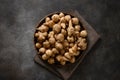 Jerusalem artichoke root, sunchokes on dark brown