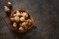 Jerusalem artichoke root, sunchokes on dark brown